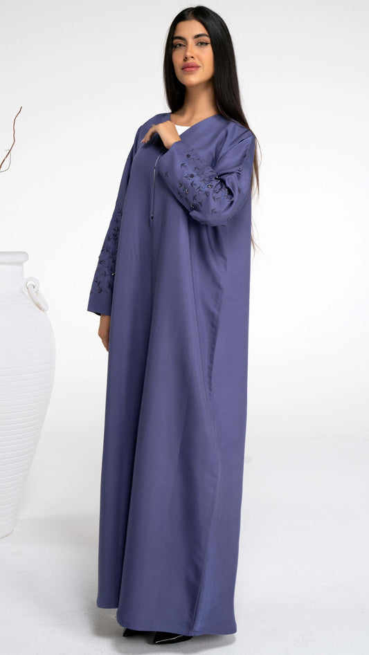 Girl wearing blue abaya with thread floral embroidery sleeve with bead embellishment