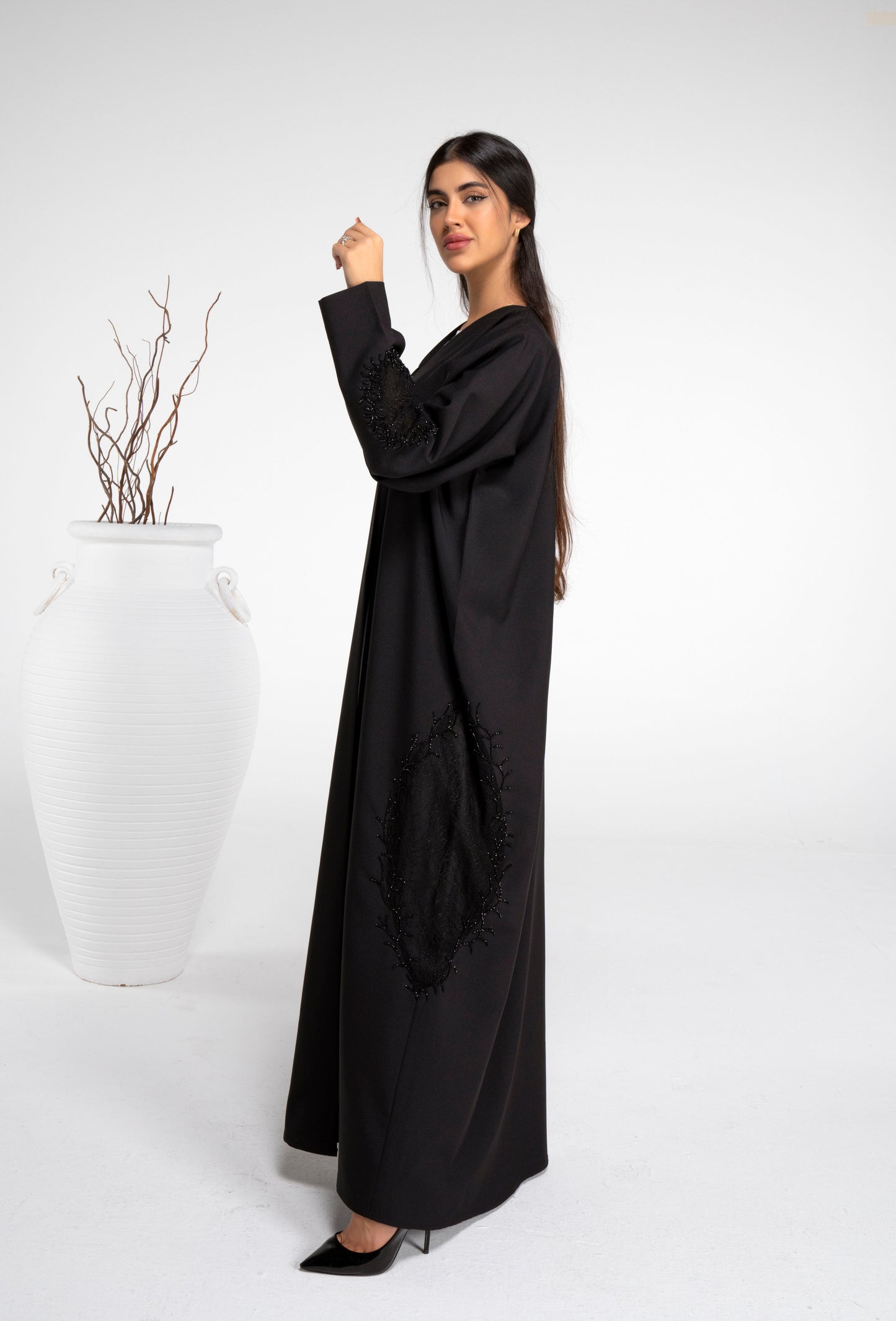 Black net abaya with beads on side and sleeves.