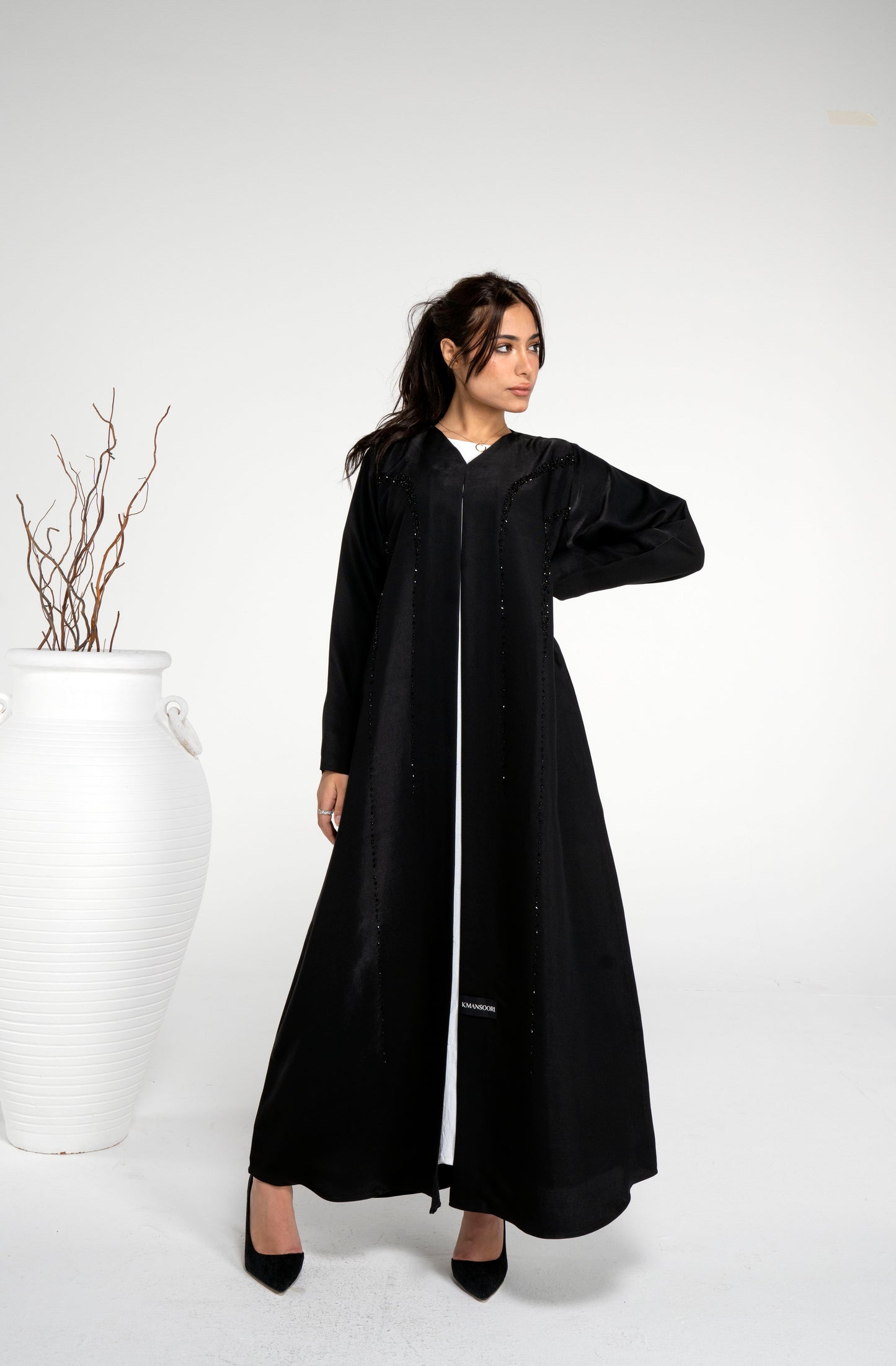 Black abaya with princess line bead embellishment