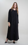 girl wearing black abaya with floral curve line embroidery and bead embellishments on front and sleeve