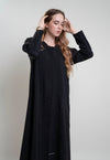 detail view of black abaya with bead embellishments and floral curve line embroidery