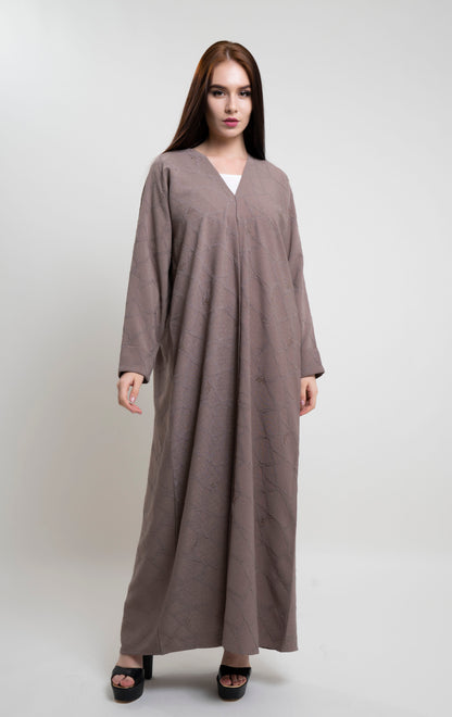 Girl wearing Beige Abaya With Simple Bead Highlights