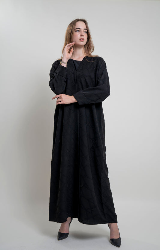 Girl wearing Bisht black Abaya with Simple Bead Highlights