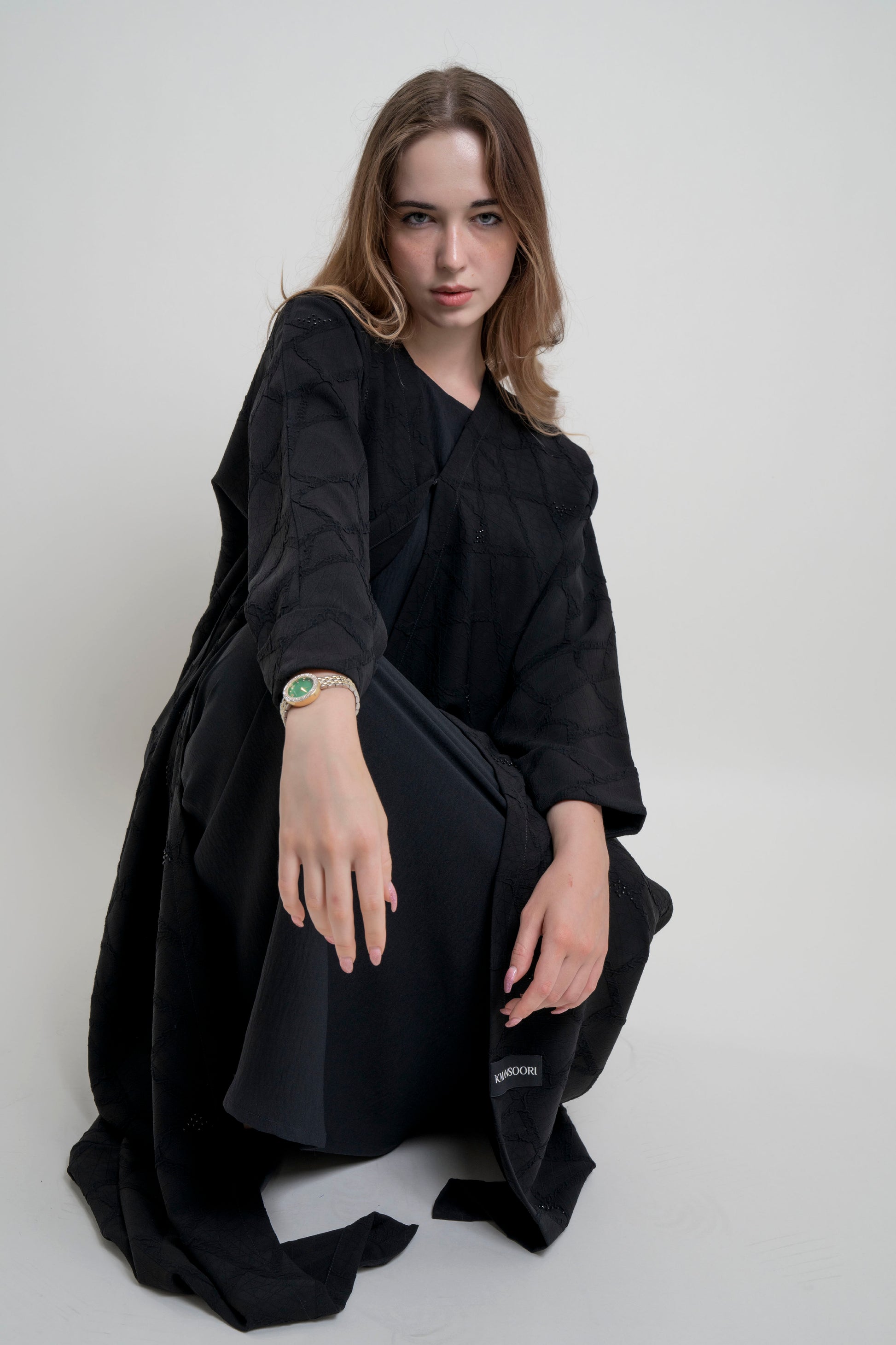 Girl wearing Bisht black Abaya 