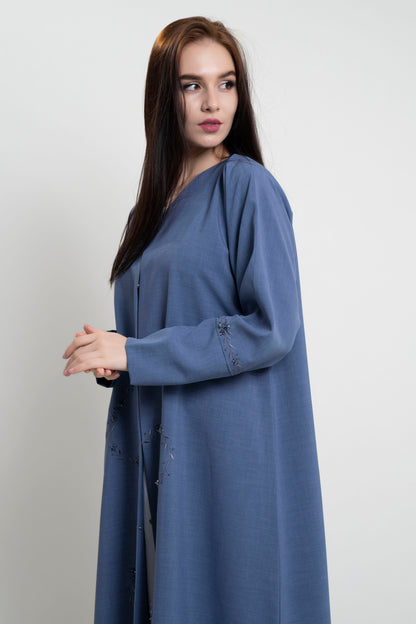 Girl wearing blue abaya with floral curve line embroidery with bead embellishments