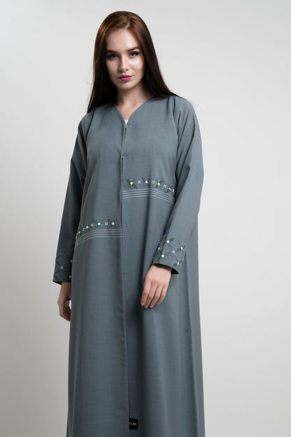 Green abaya with floral thread embroidery.