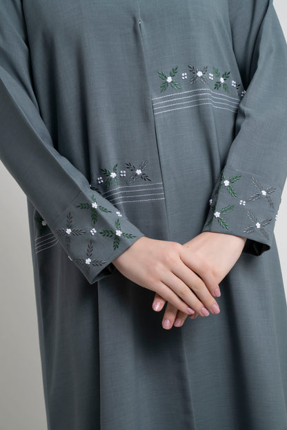 Floral thread embroidery on front and fold sleeve.