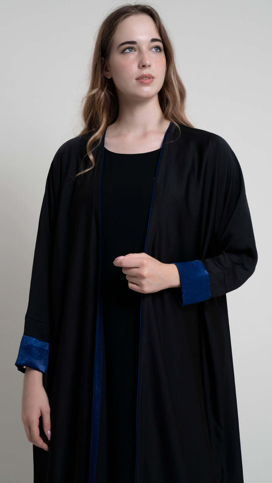 View of black abaya with blue color cuff sleeve and piping on front line