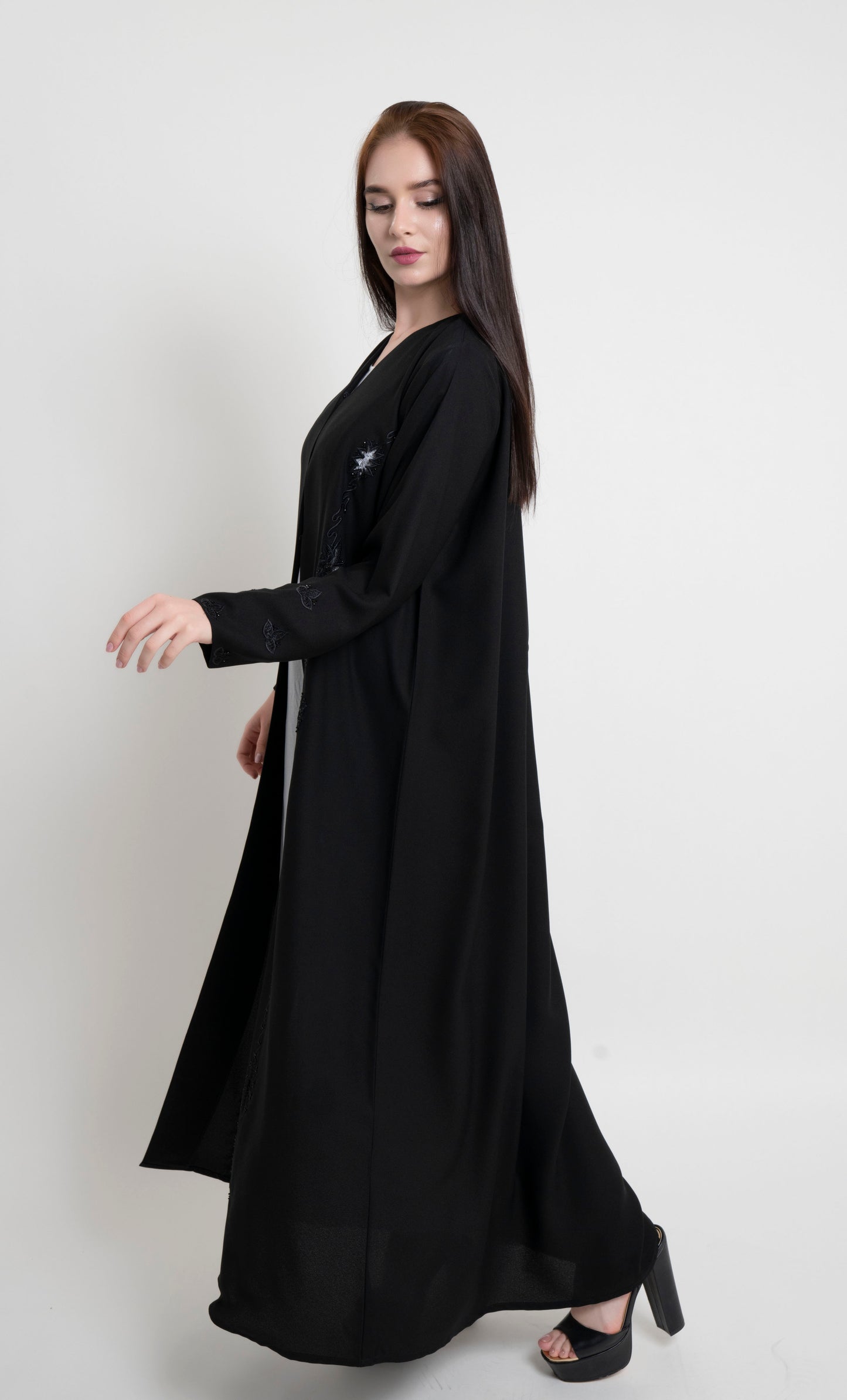 Side view of black net designed abaya with embroidery and bead detailing