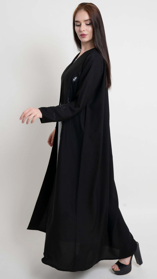 Side view of black net designed abaya with embroidery and bead detailing
