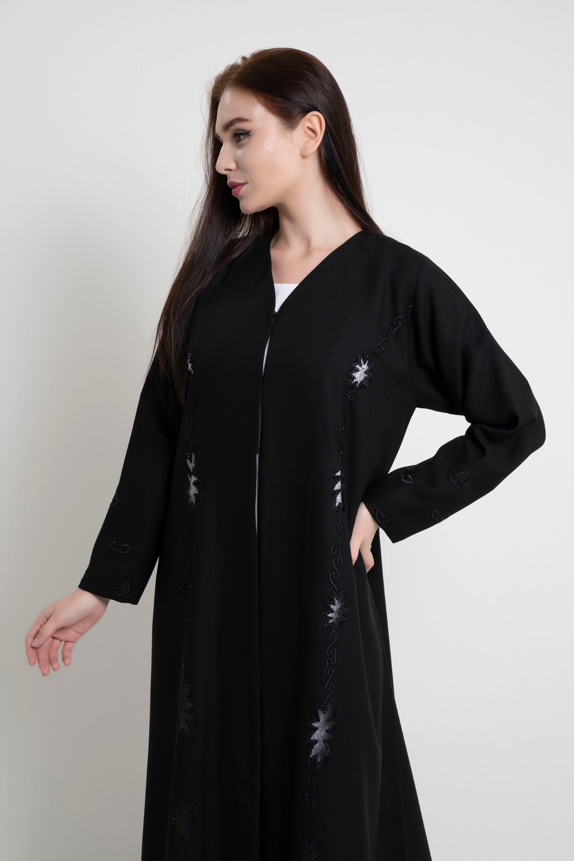 Side view of black net designed abaya with embroidery and bead detailing