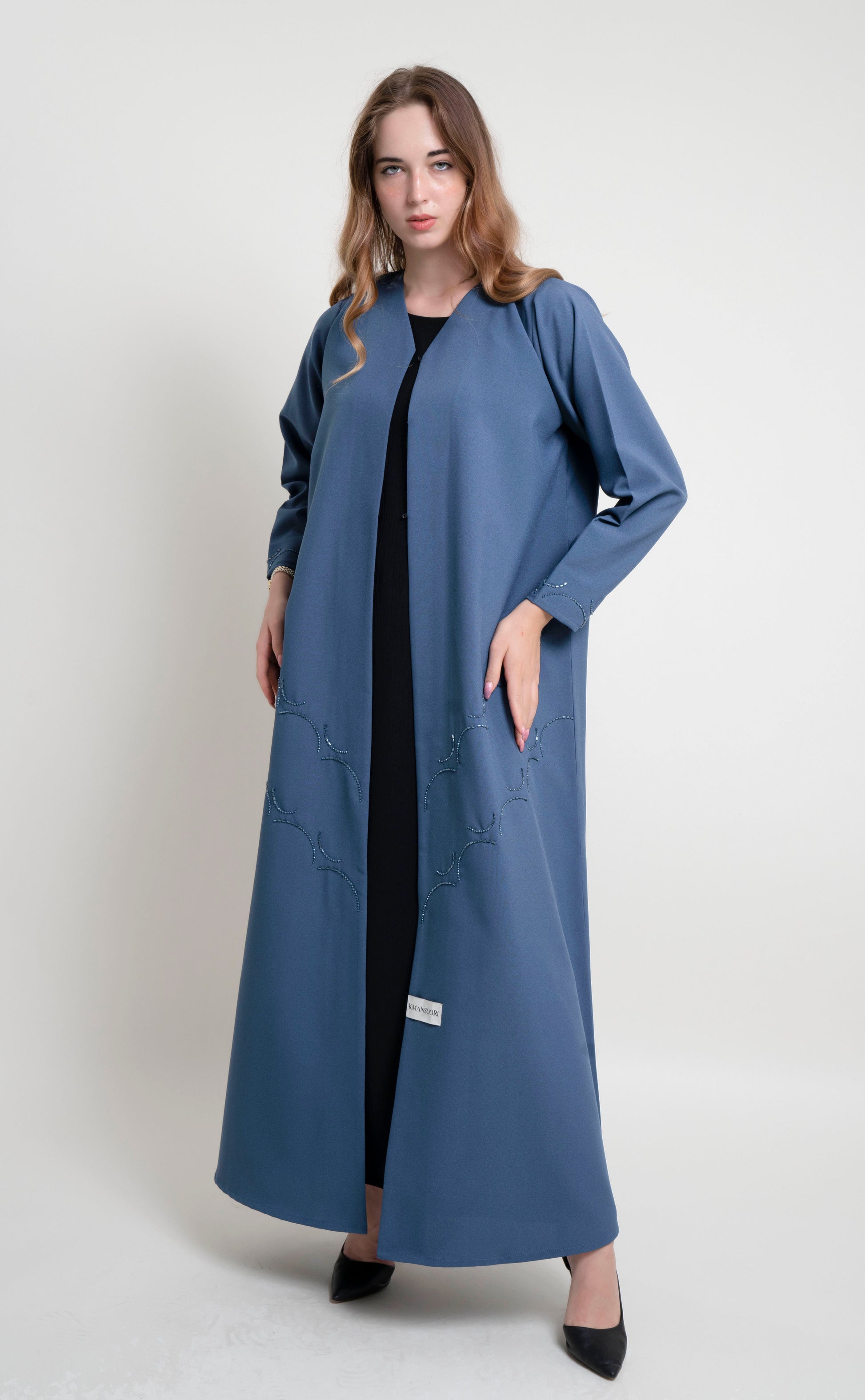 Sky blue curve abaya with bead embellishments on front and sleeves