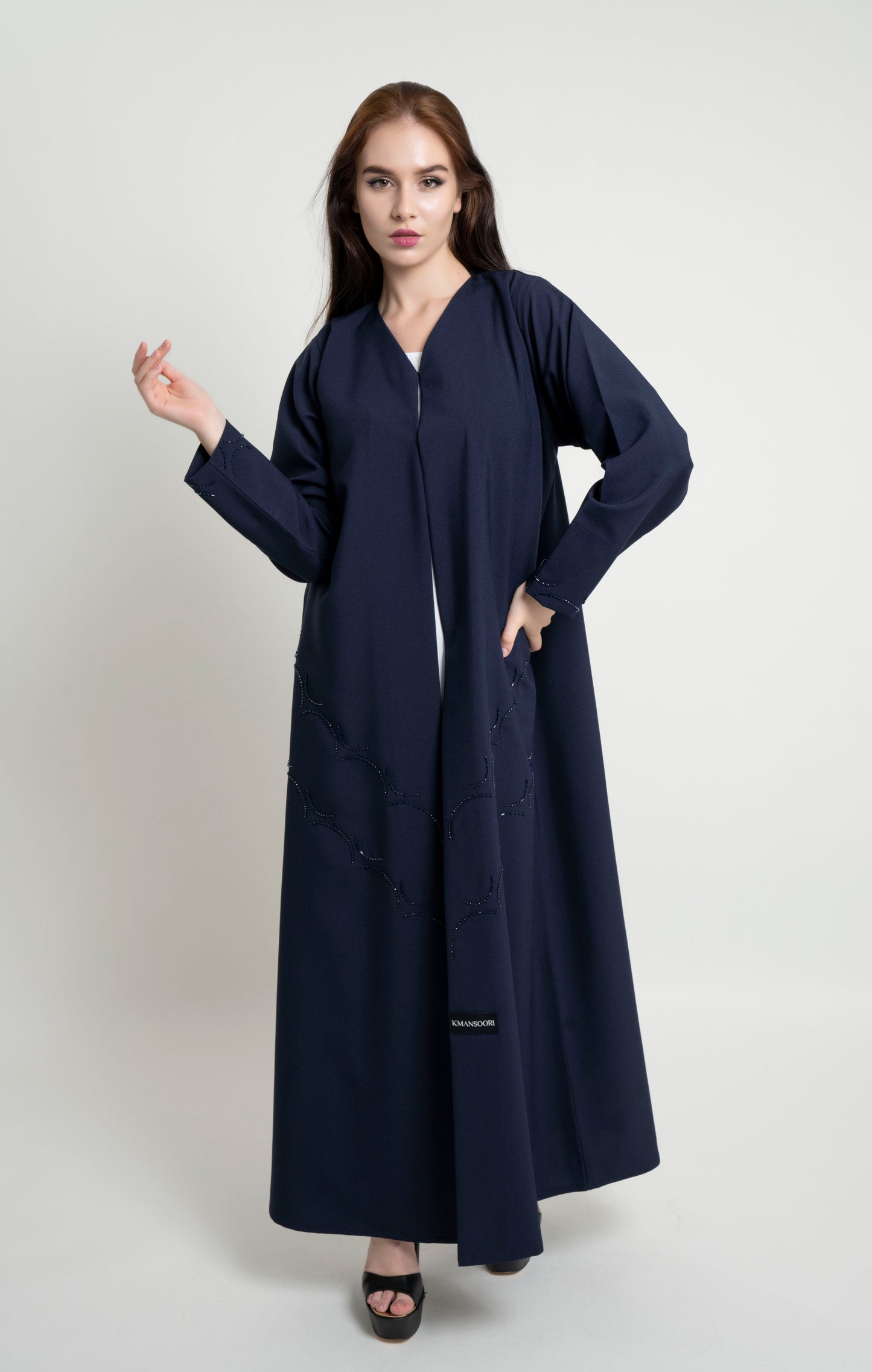 Dark blue abaya with curved bead embellishment on front and sleeve 