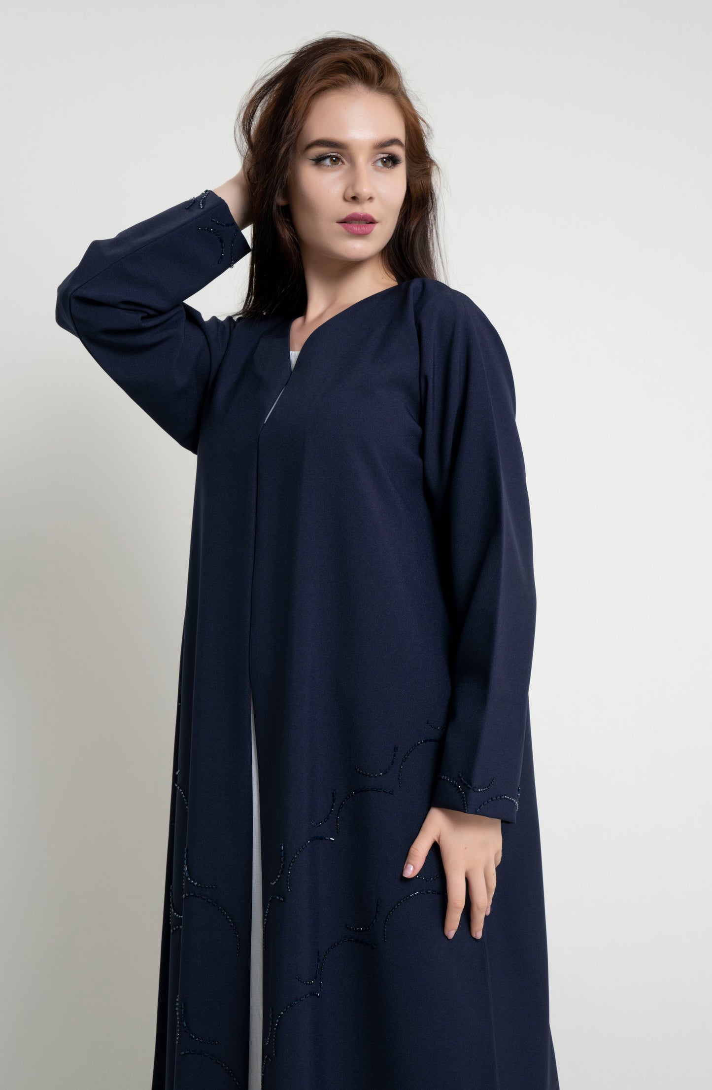 Dark blue abaya with curved bead embellishment on front and sleeve 