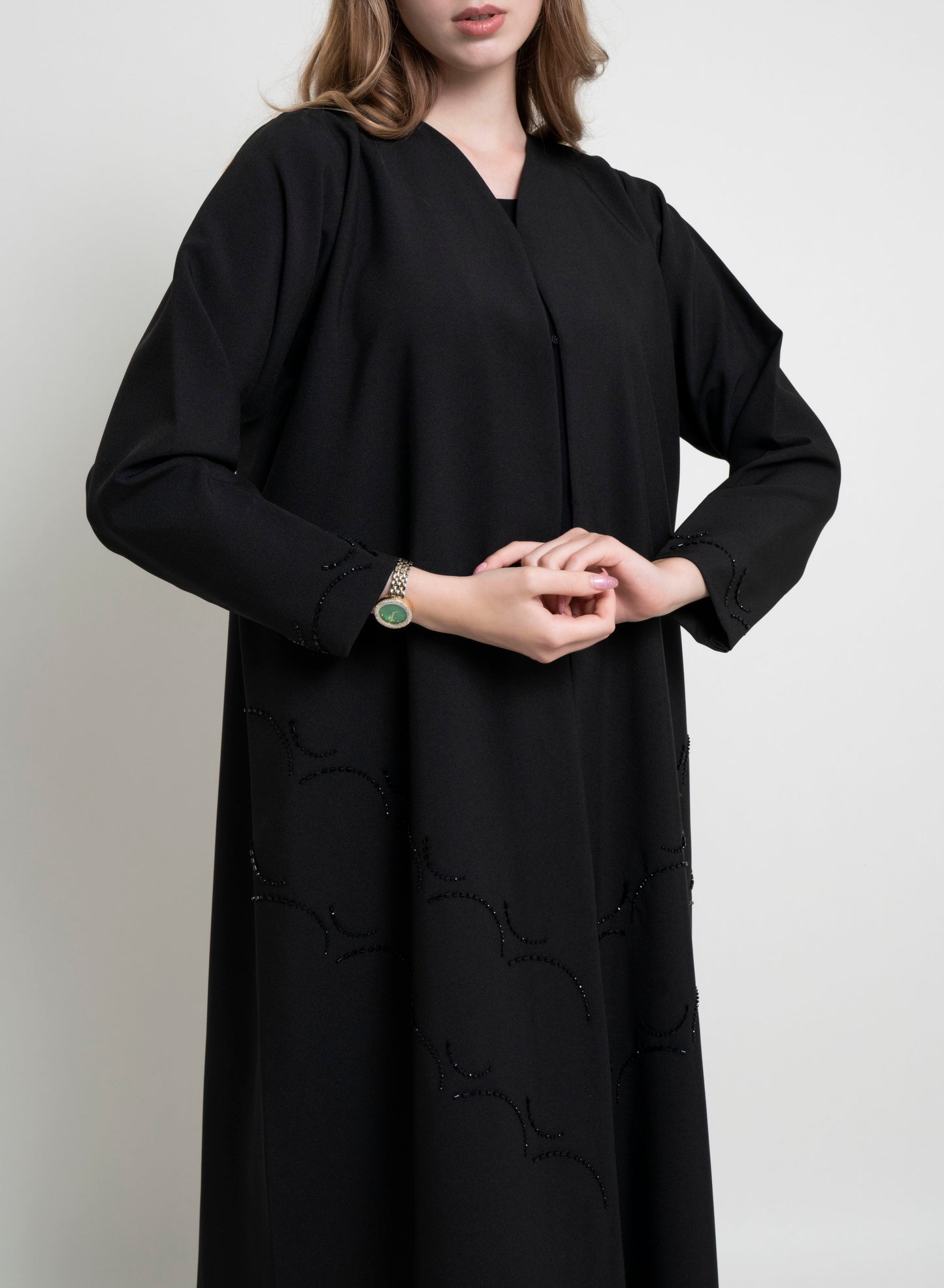 Elegant Curve Design with Detailed view of Bead Embellishment on Front and Sleeves of this abaya for women
