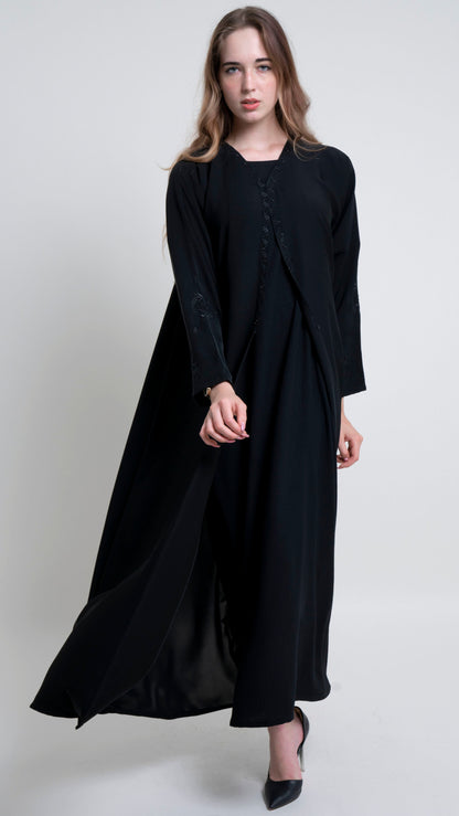 Flow of black abaya with Embroidered Neckline and Floral Motif Sleeves