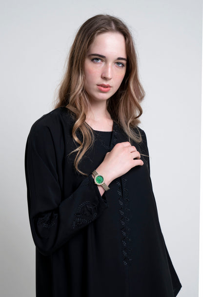 Detailed view of black abaya with embroidered Neckline and Floral Motif Sleeves