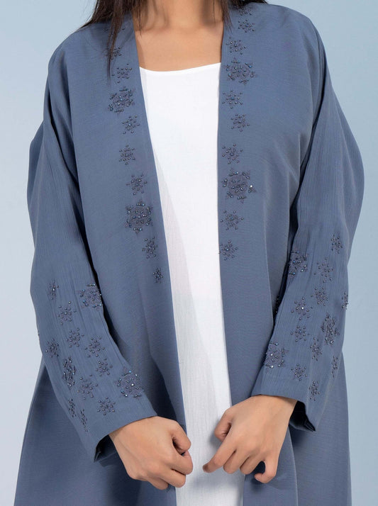 Snowflake embroidery on Top front flap and sleeves on sky blue bisht abaya.