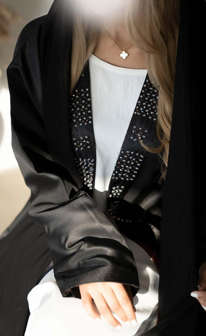 Black abaya with French knots in Dubai