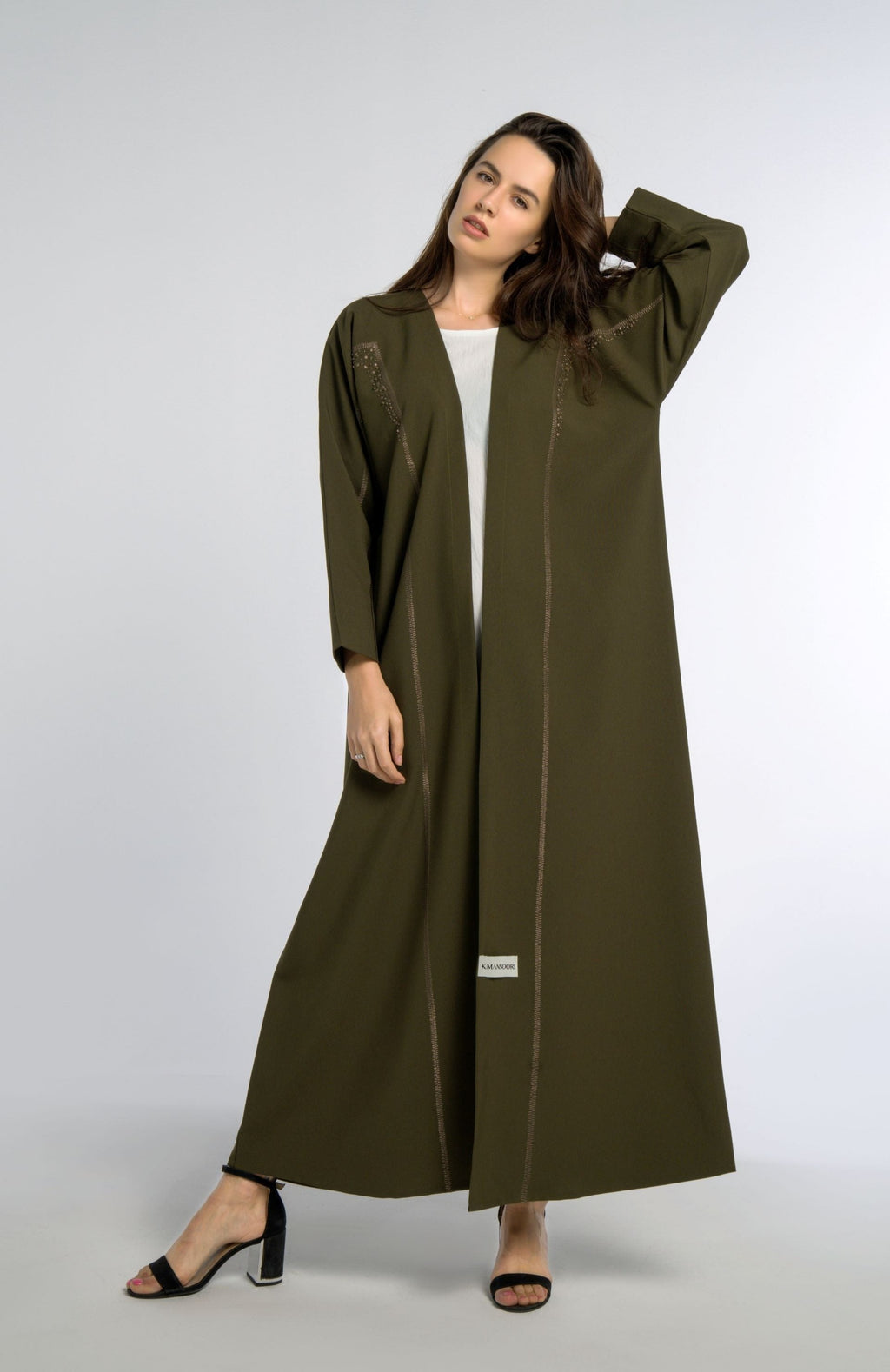 Green colored bisht abaya with geometric patterned embroidery