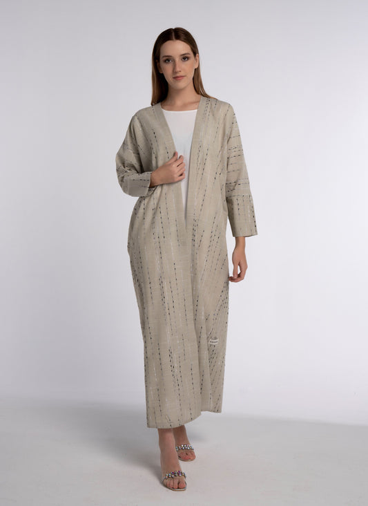 Beige abaya with cut joined sleeve pattern.