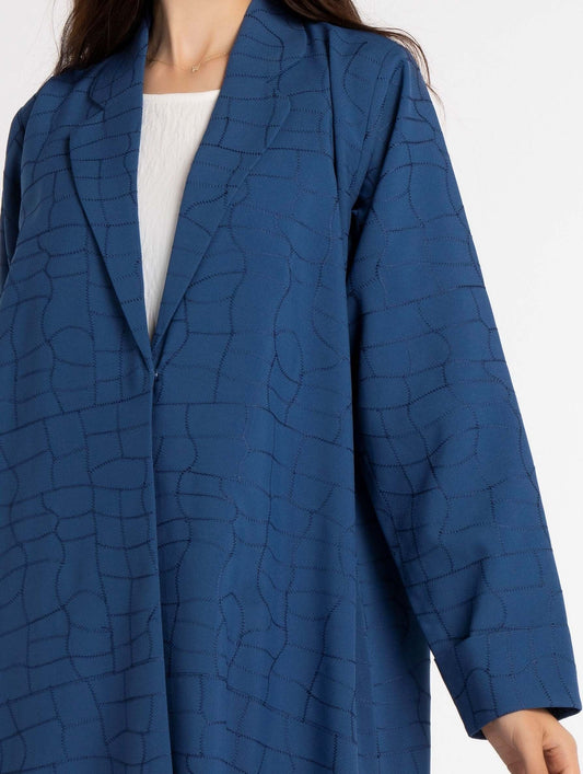 Detailed view of machine print of sky blue abaya.