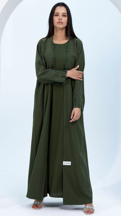 Green bisht abaya with curve cut embellishments on flap and sleeves.
