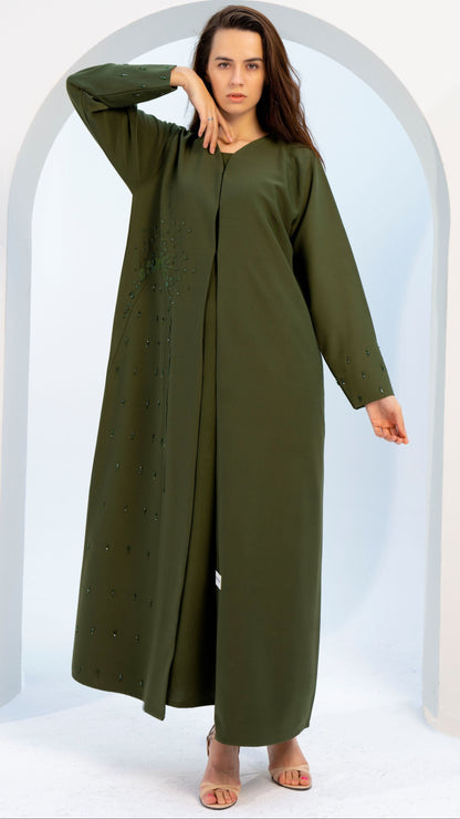 girl wearing green colored V-neck abaya with embellishments
