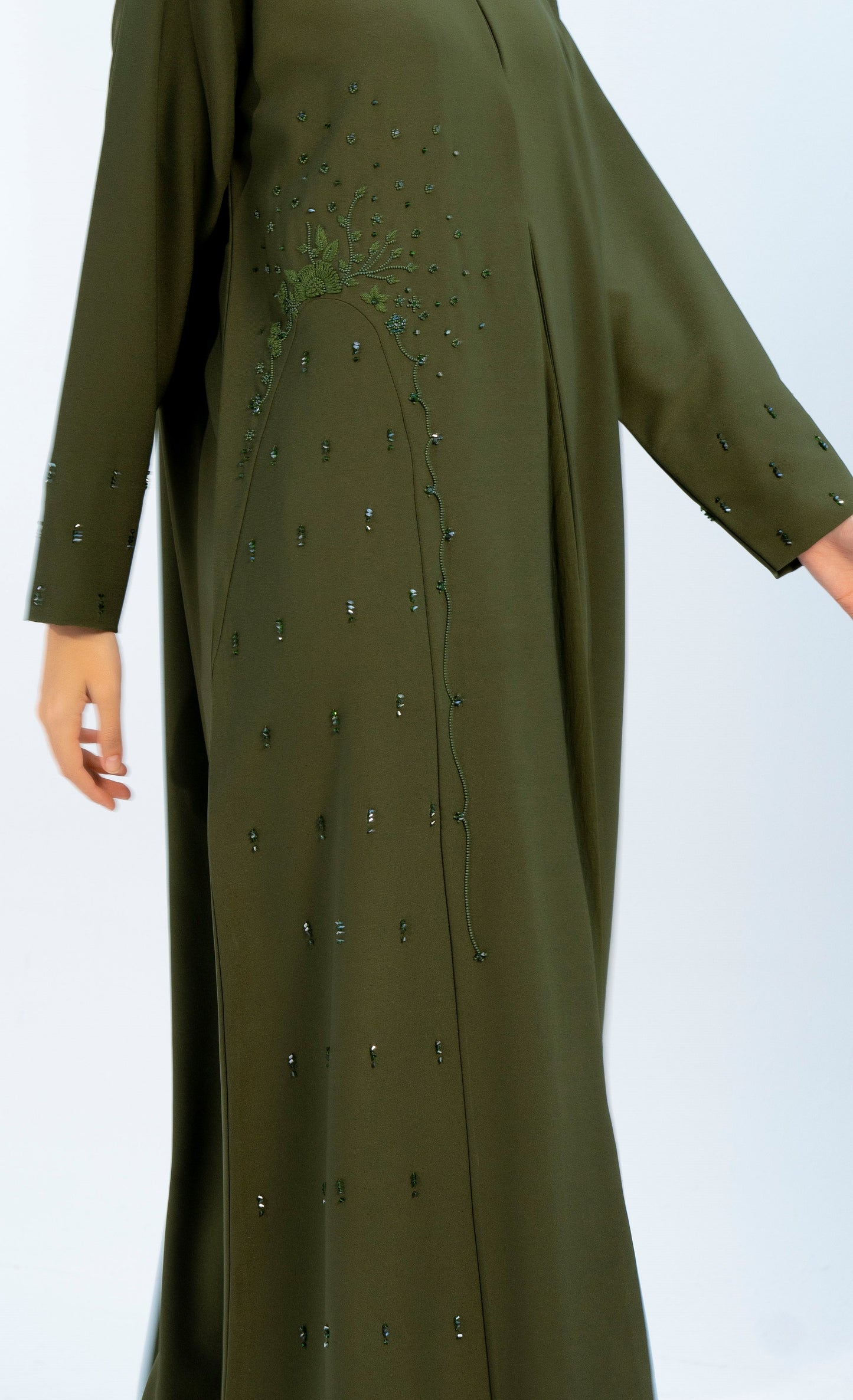 detailed view of abaya with embellishments on side and sleeves