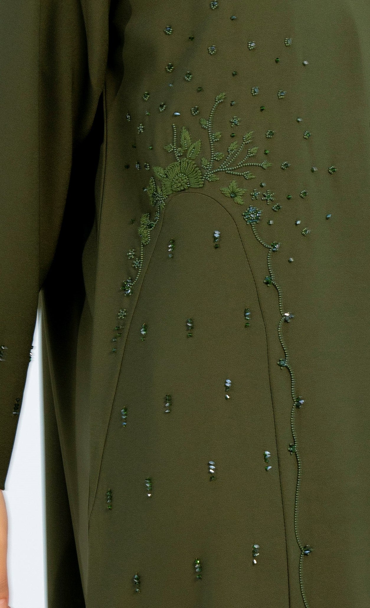 view of embellishments on green abaya
