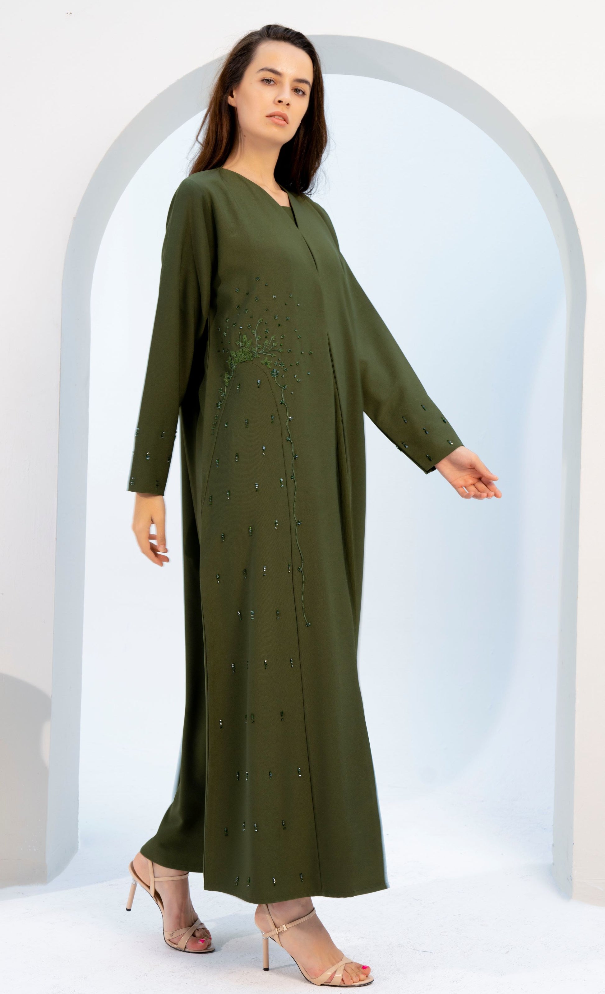 girl wearing green abaya with embellishments