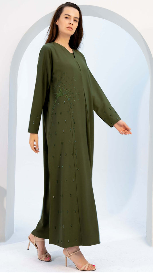 girl wearing green abaya with embellishments