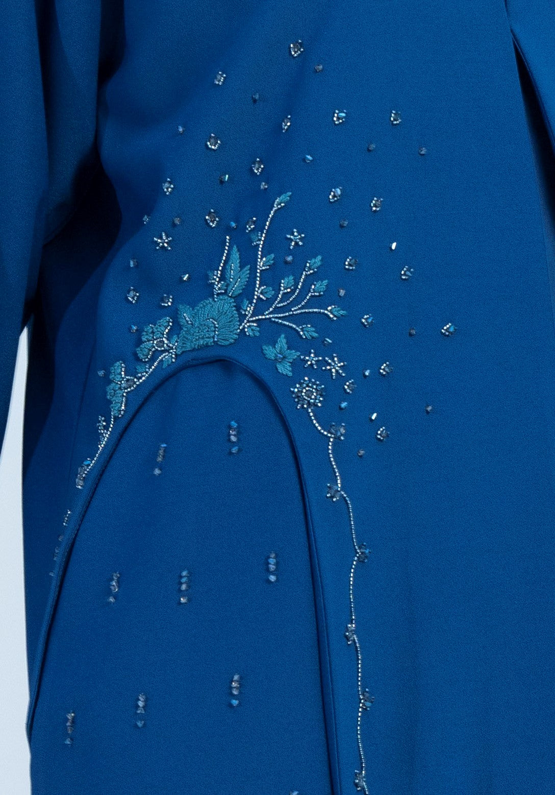 Sky blue abaya with embellishments on side and both sleeves.