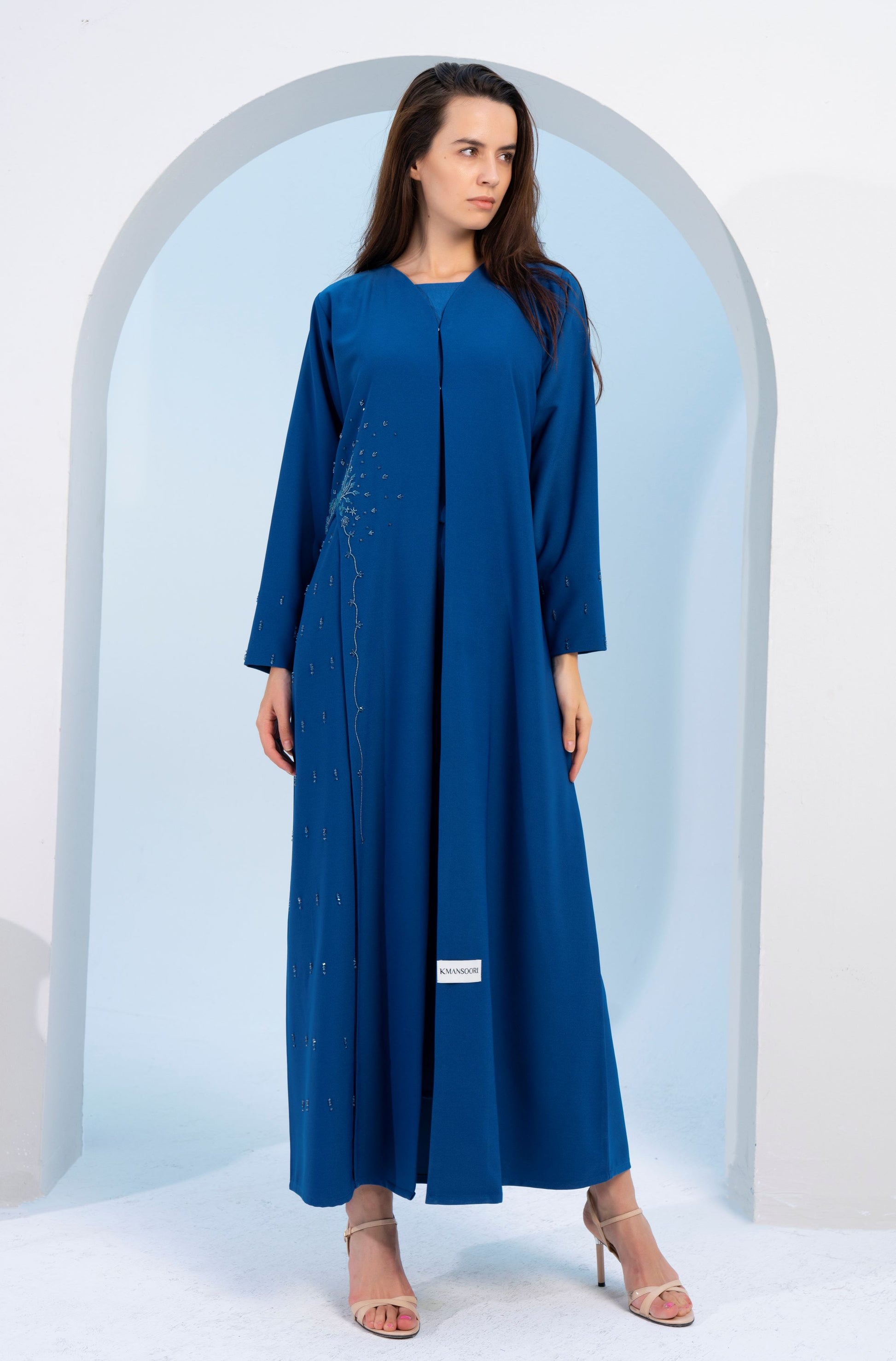 Girl wearing sky blue abaya for women.