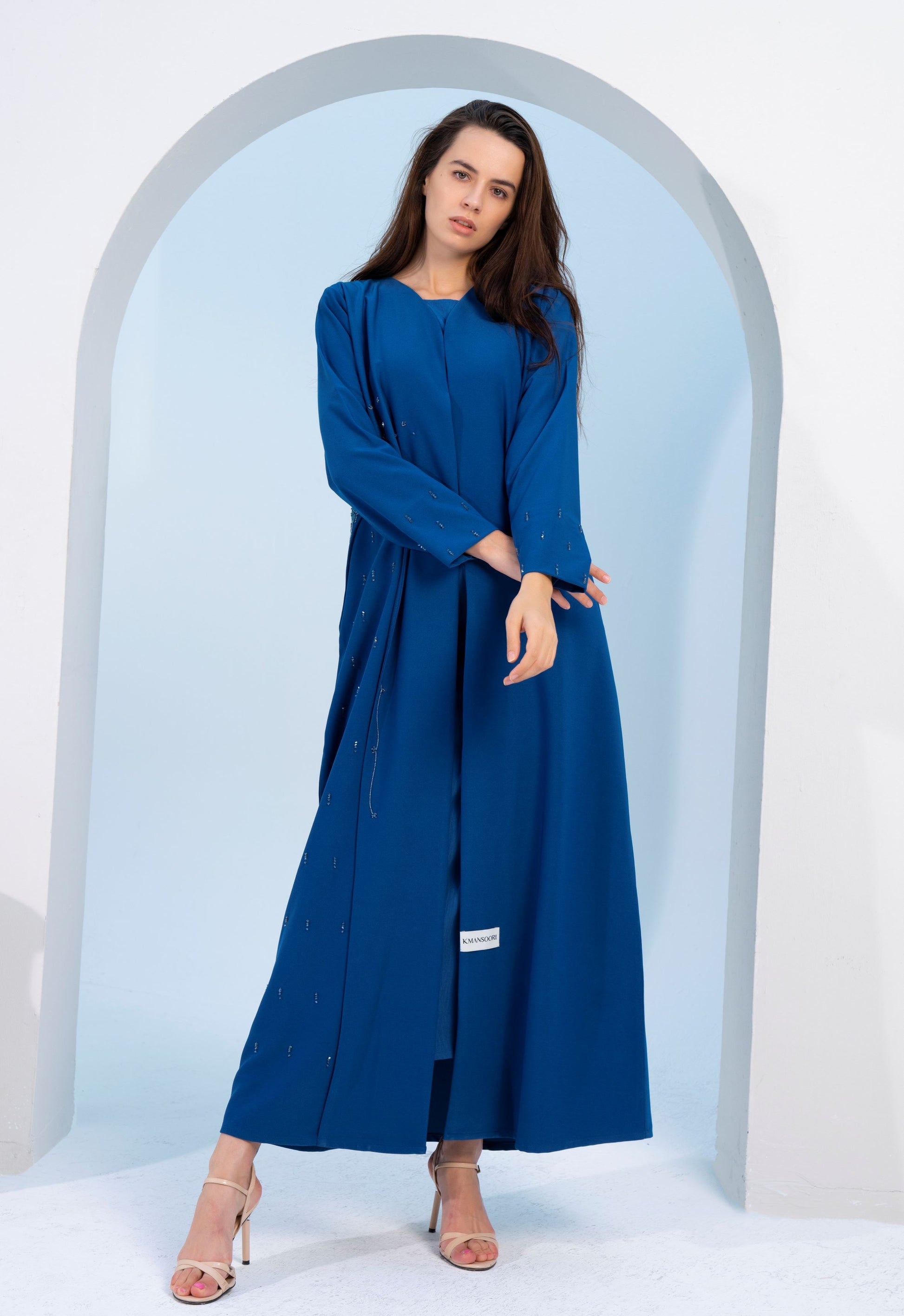 Sky blue V-neck abaya with embellishments on side and both sleeves.