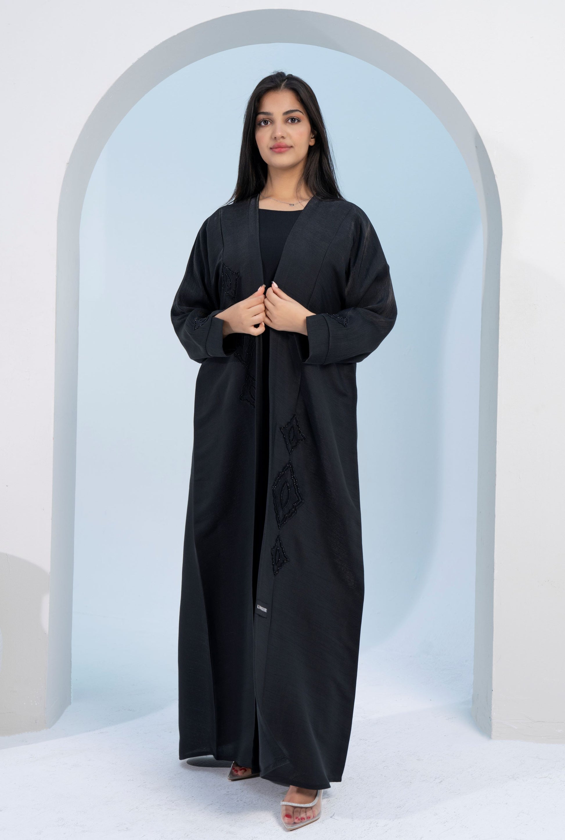 girl wearing black abaya dress