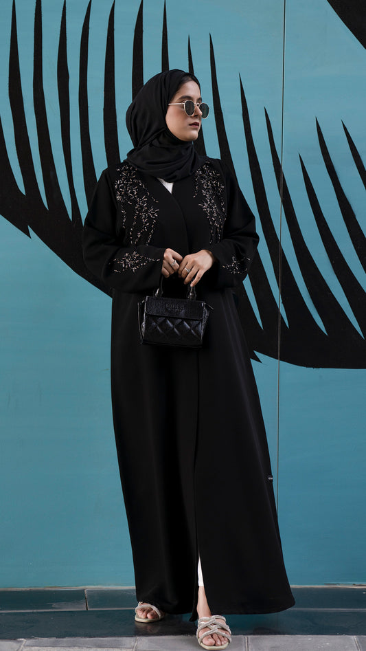 Women  wearing Elegant black abaya with coloured bead detailing