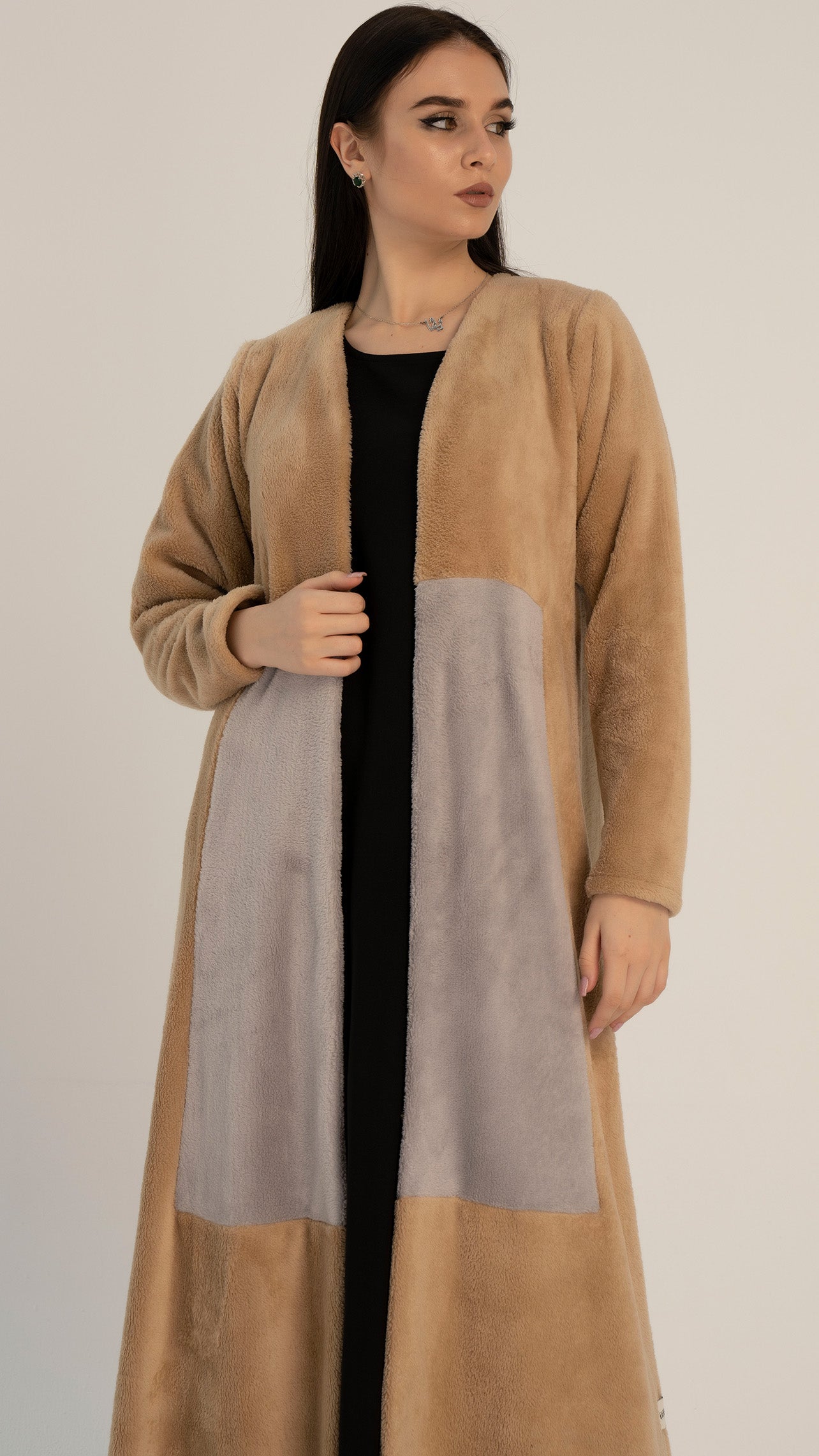 Soft textured abaya with color block pattern on front.