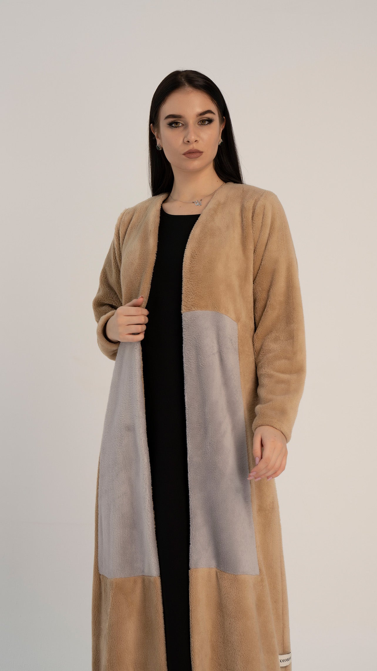 Woolen abaya with color block pattern on front.